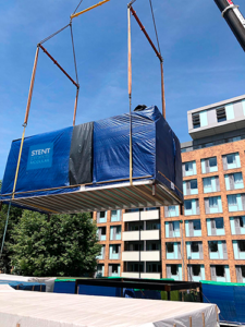 Modular classroom being crane lifted into position